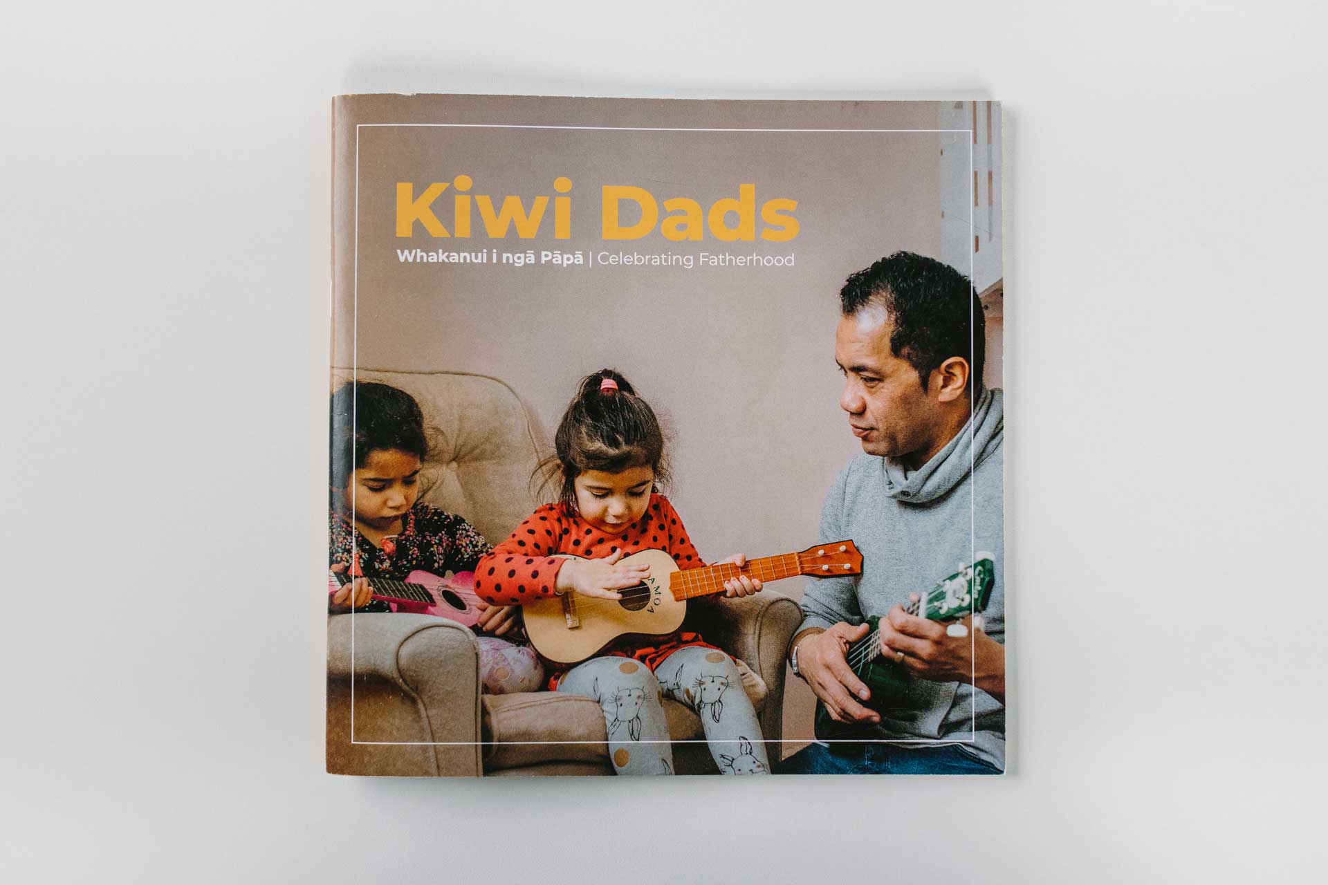 cover of kiwi dads booklet by global women and parents at work with photos by sarah weber photography